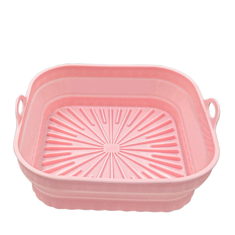 Pink collapsible basket with handles on a white background