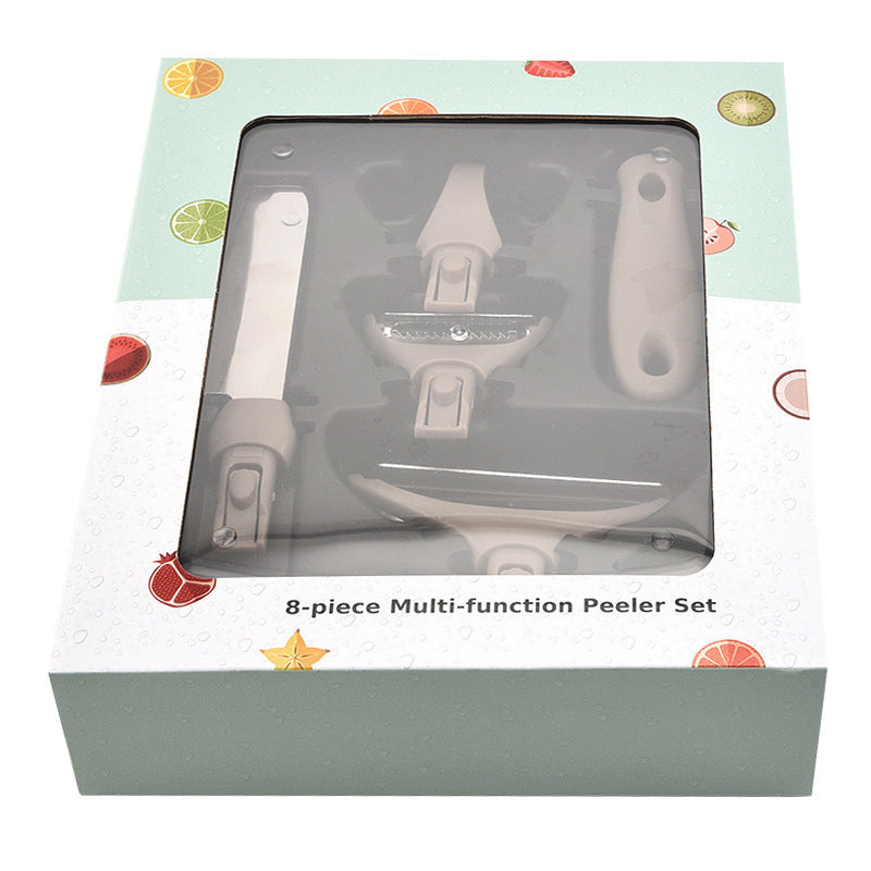 8-piece multi-function peeler set in packaging with fruit illustrations on a white background