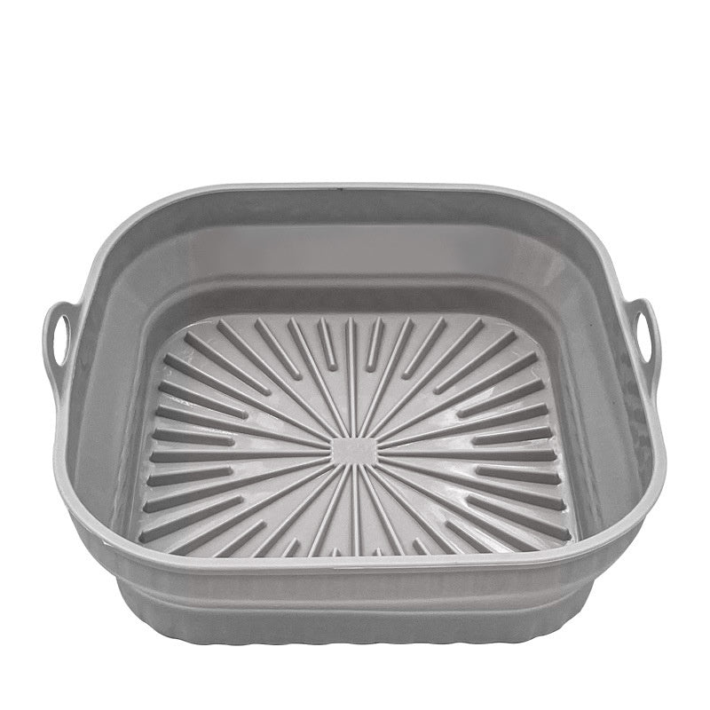 Gray square grill pan with handles on a white background