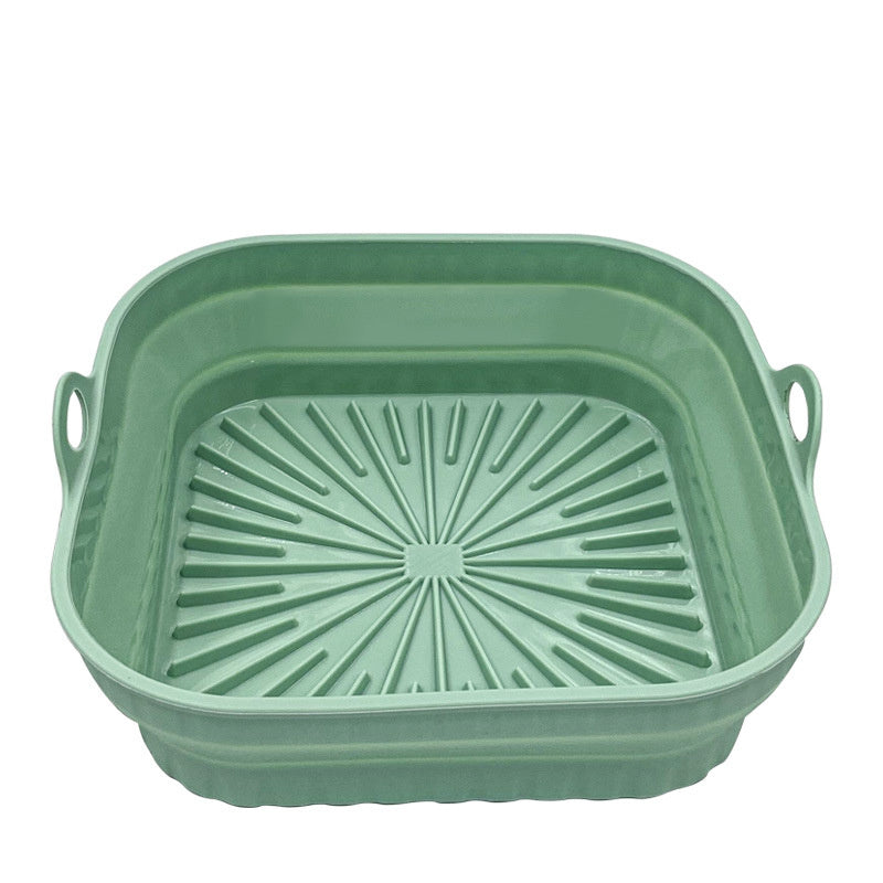 Green collapsible basket with handles on a white background