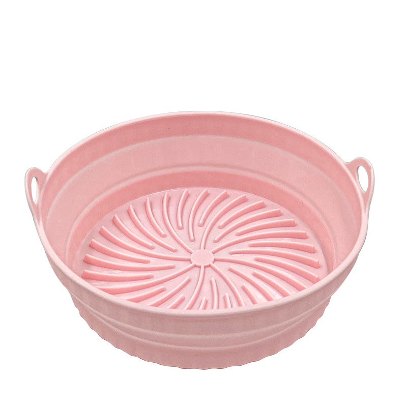 Pink collapsible basket with handles on a white background